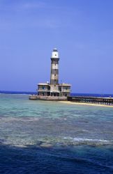 Daedalus reef lighthouse. F50,60mm. by Derek Haslam 